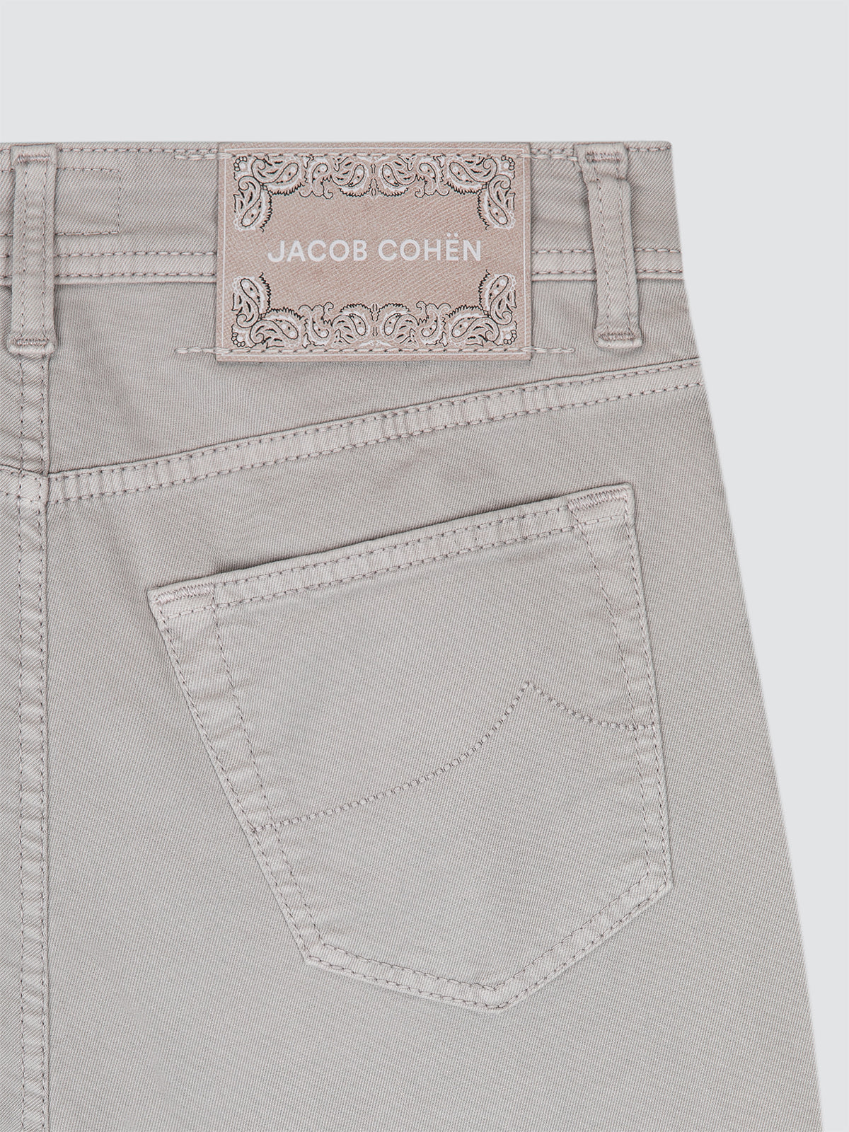 Greige pants with Jacob Cohen label on a white background