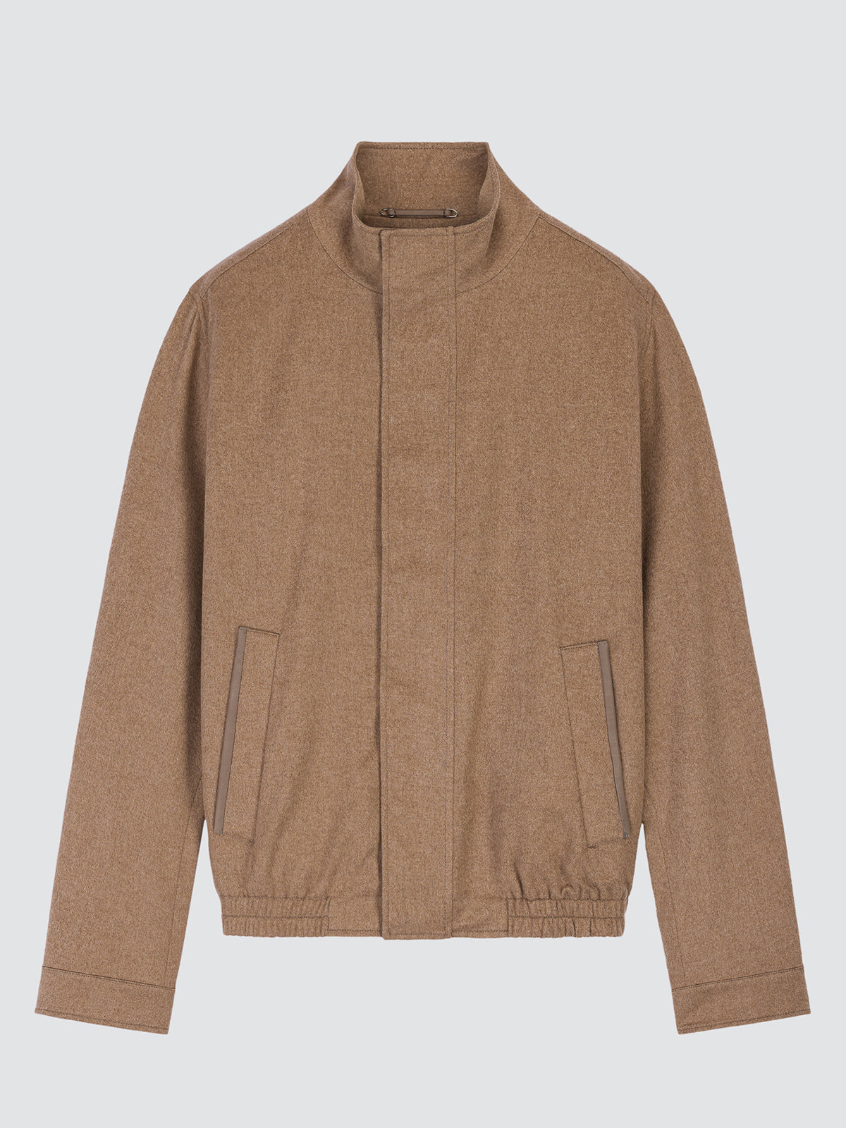 A tan wool-blend jacket with a stand-up collar, front zipper, and two zippered hand pockets, shown against a light gray background. loro piana cashmere