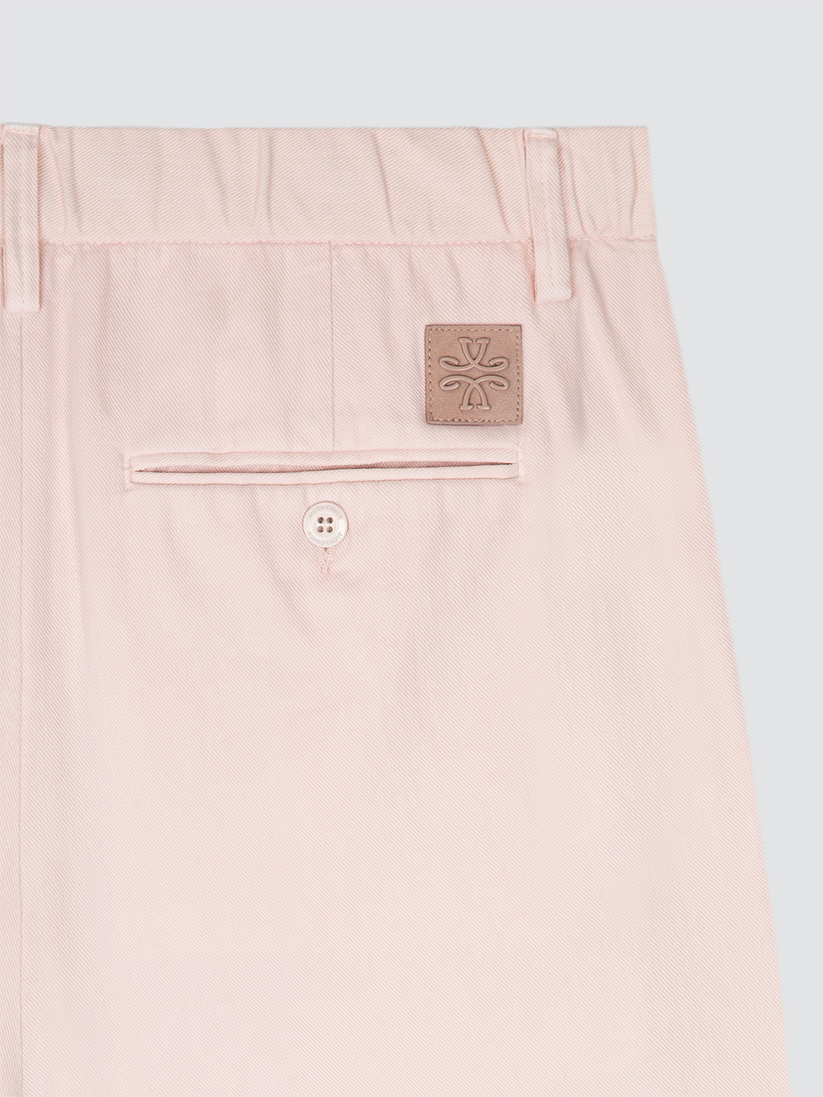 Blush sand short with a brand logo Jacob Cohën on a light gray background