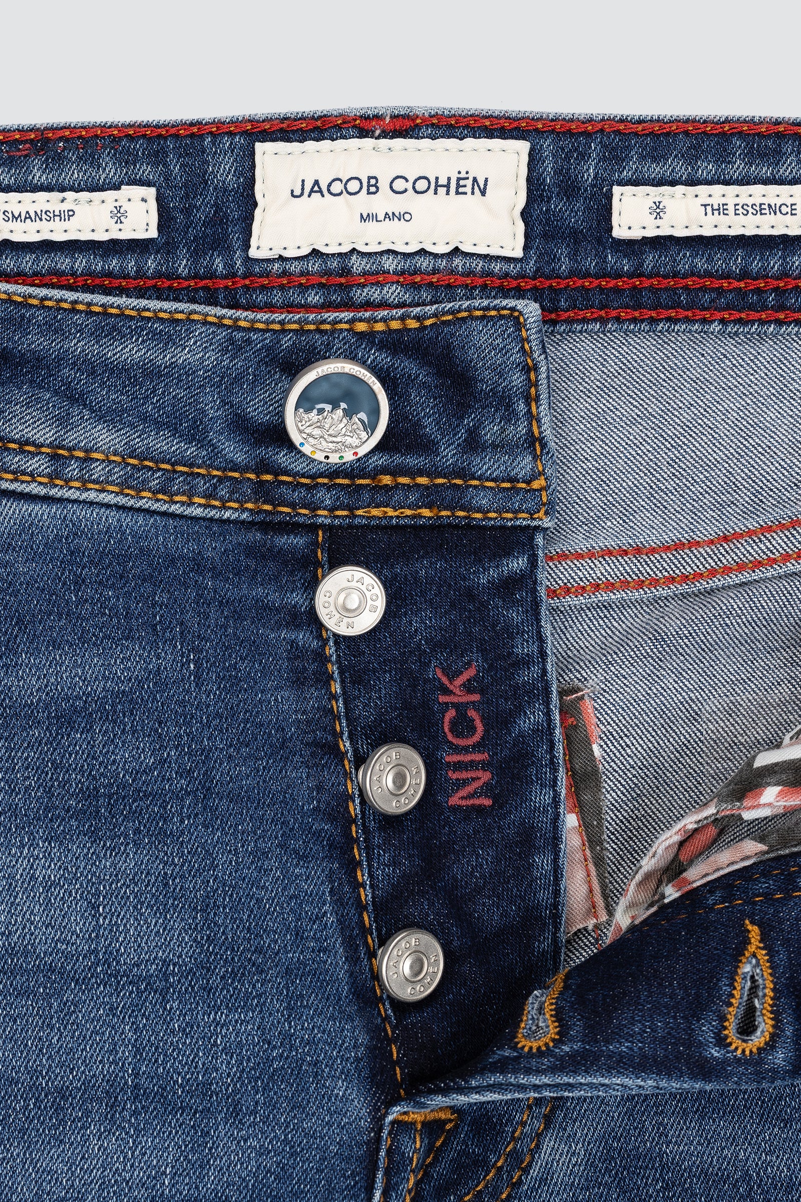 Close-up of Jacob Cohen jeans with brand label and button details Milano Cortina olympic