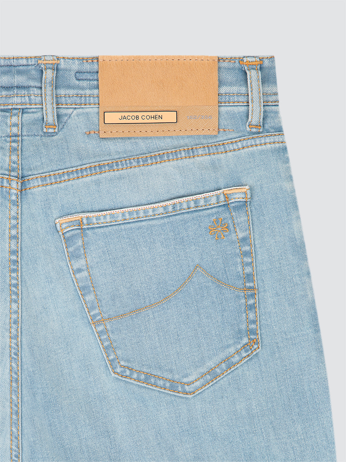 Jacob Cohen limited edition Light blue denim jeans with a visible brand label on a light gray background