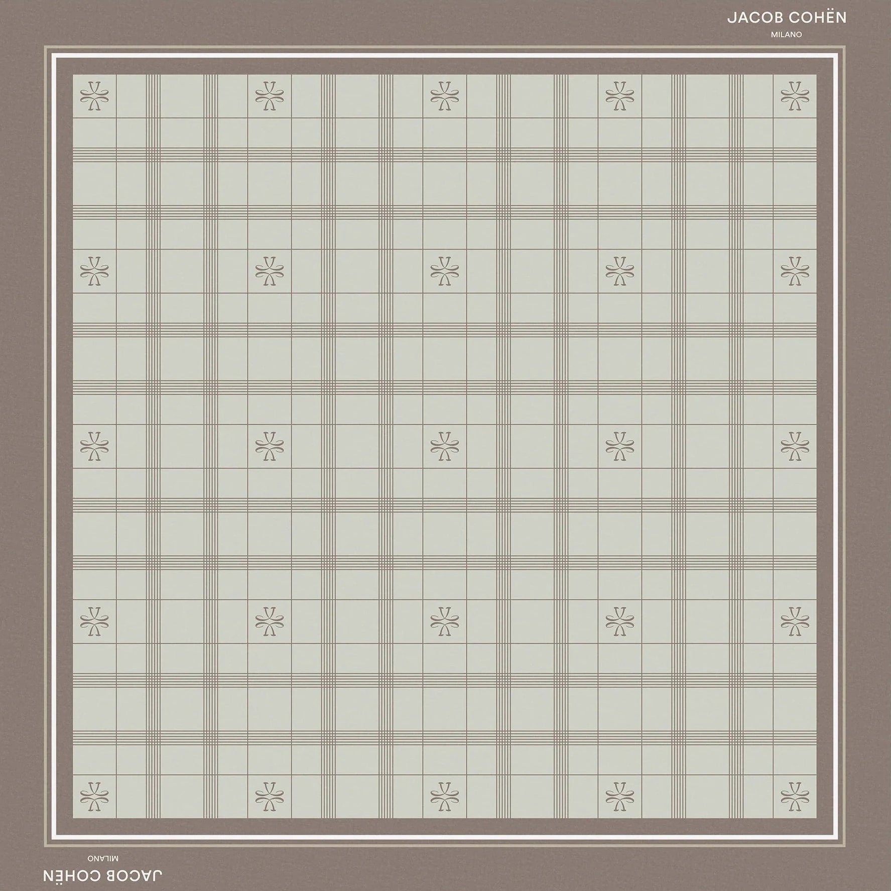 A square bandana shawl with a muted plaid pattern in sage green and taupe, featuring a solid taupe border and small floral motifs at the intersections of the plaid. The brand names 'Jacob Cohën' and 'Milano' are printed on the border.
