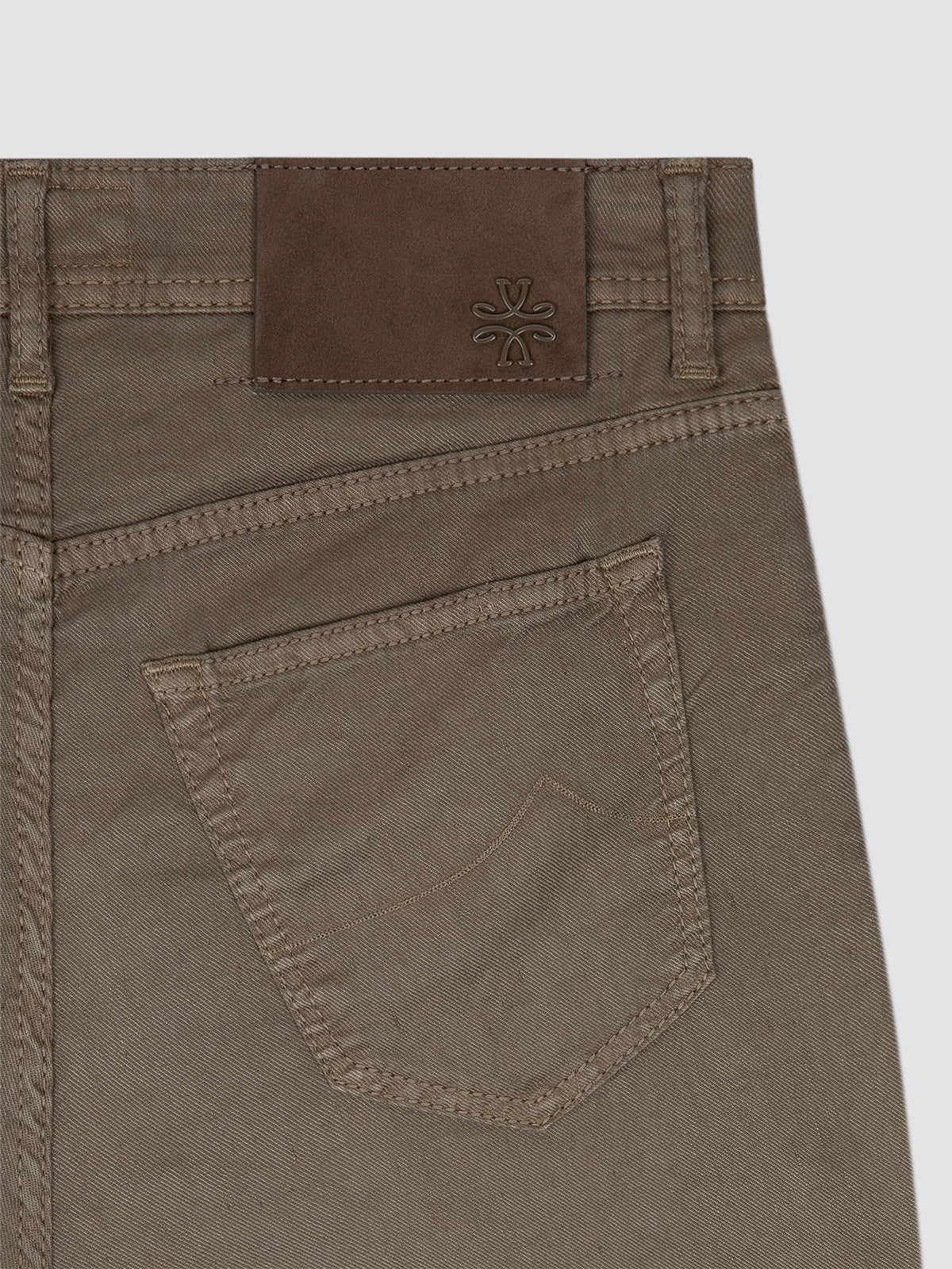 Brown Linen 5 pockets pants with a brand logo Jacob Cohën on the back against a light gray background