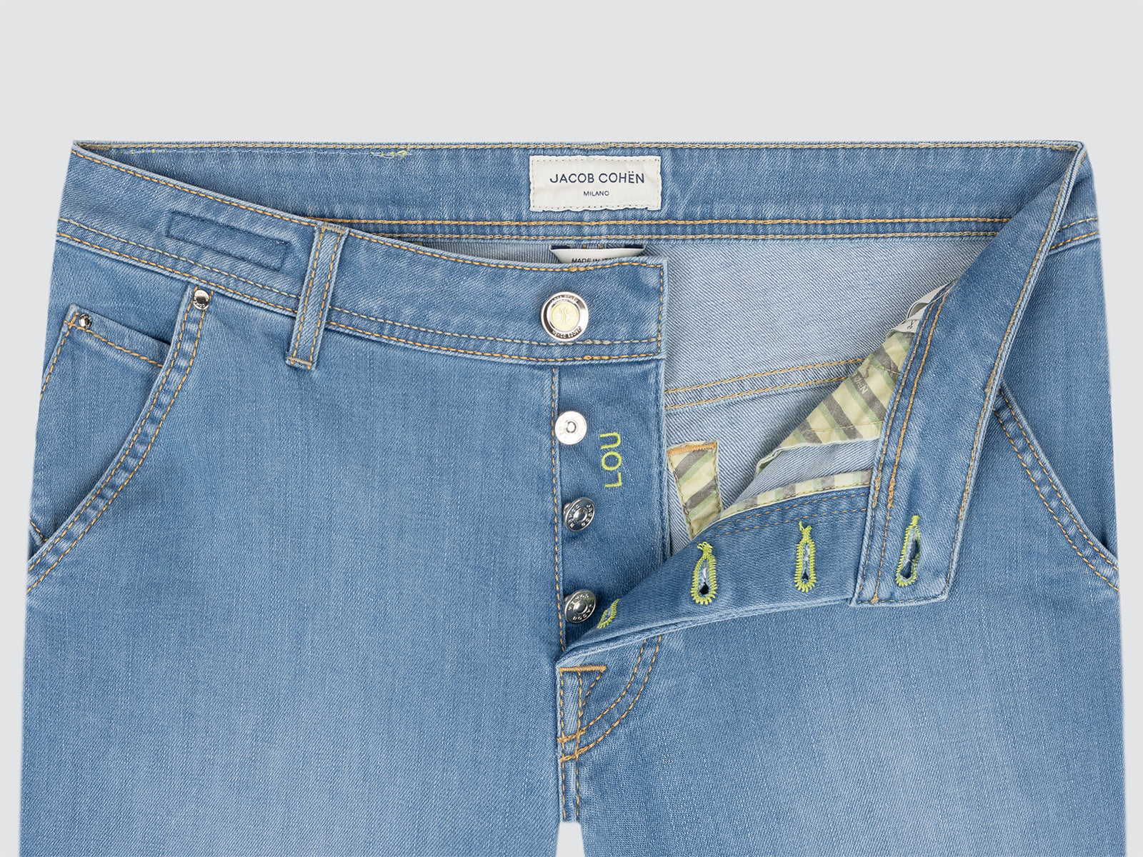 Blue bermuda jeans with a brand label on a light gray background