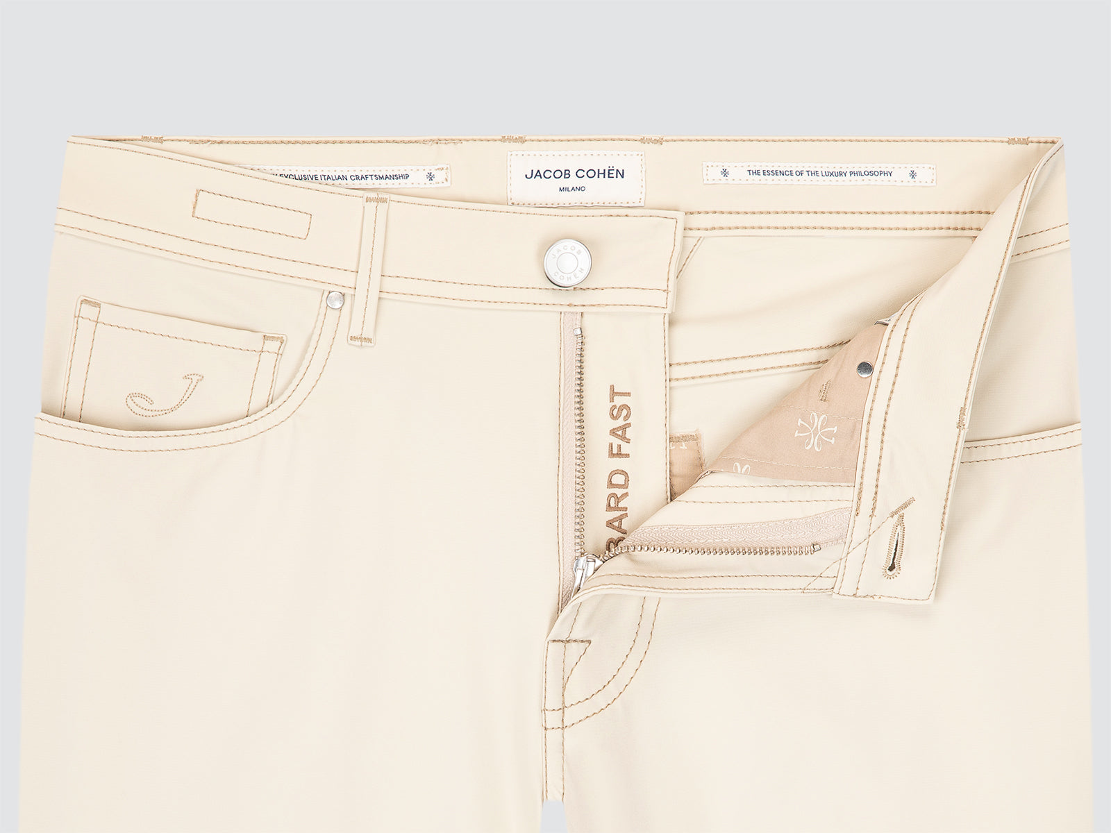 Beige jeans with brand logo Jacob Cohen on a light grey background