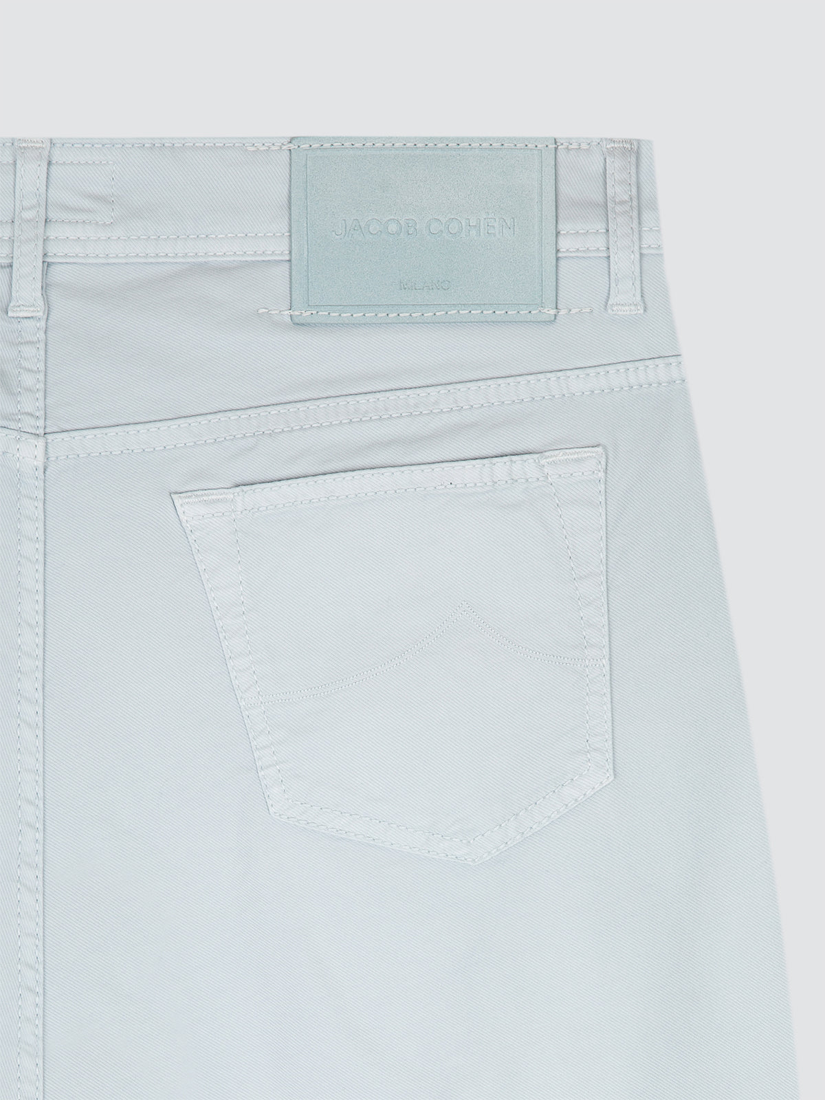 Light blue cotton short with a brand label on a light gray background