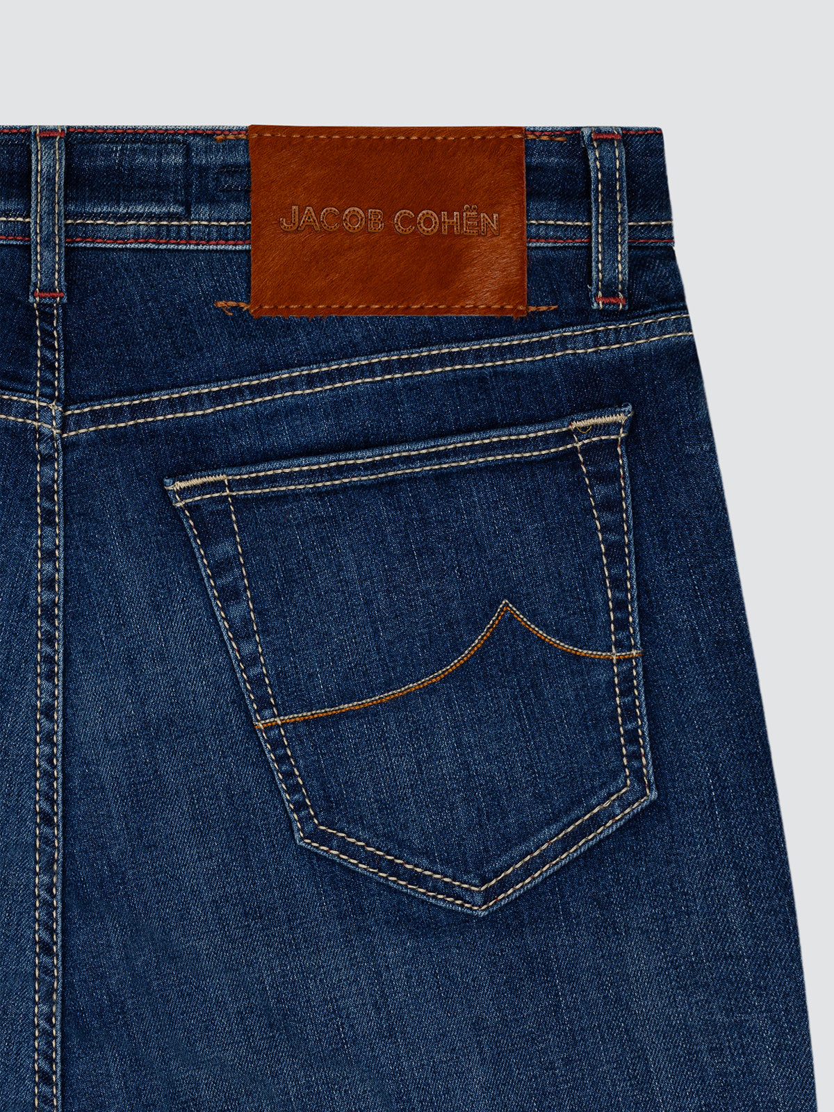 back view of blue jeans Jacob Cohën with orange brown back patch
