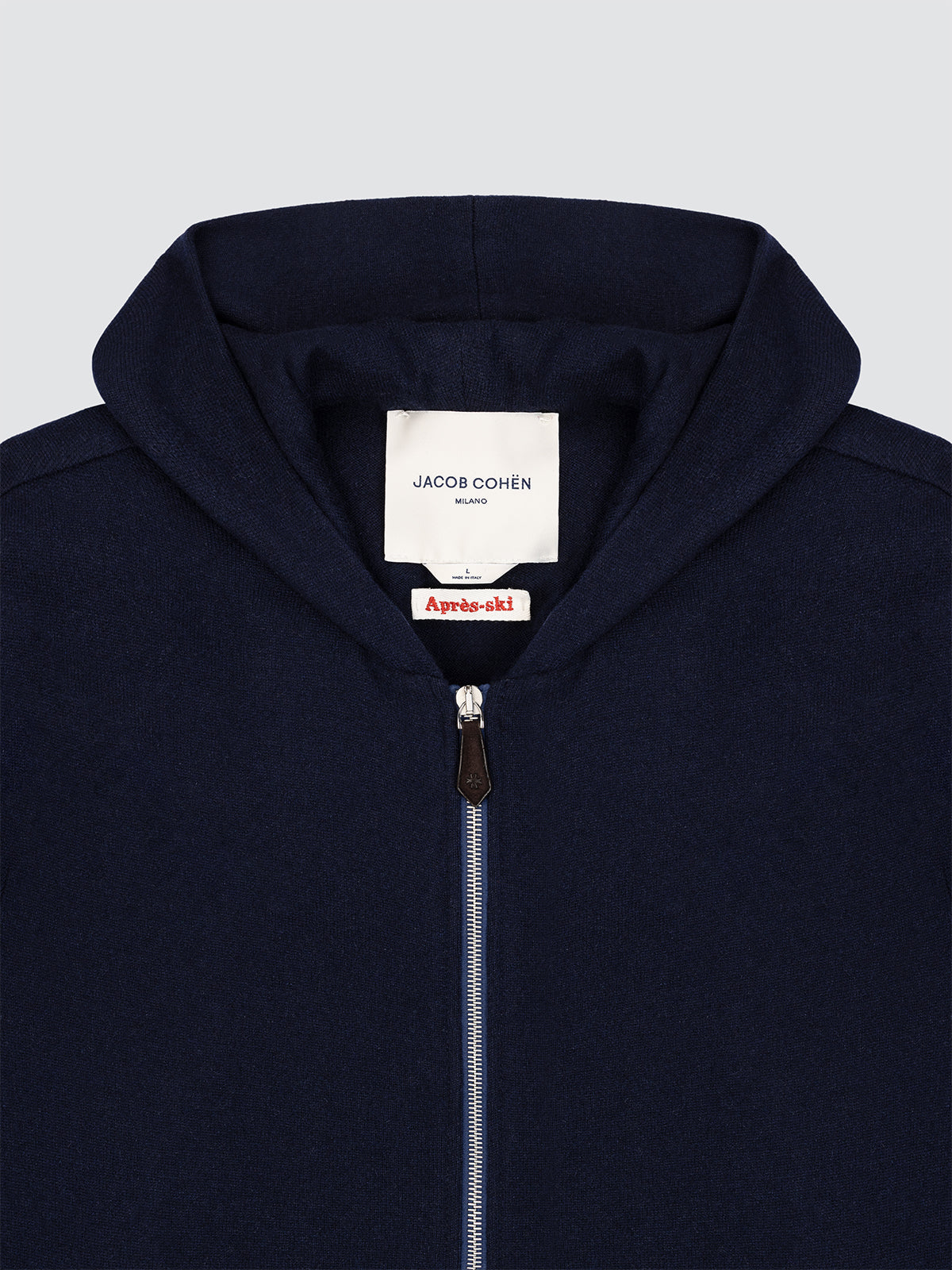 Navy blue hoodie with brand Jacob Cohen Milano labels on a light gray background