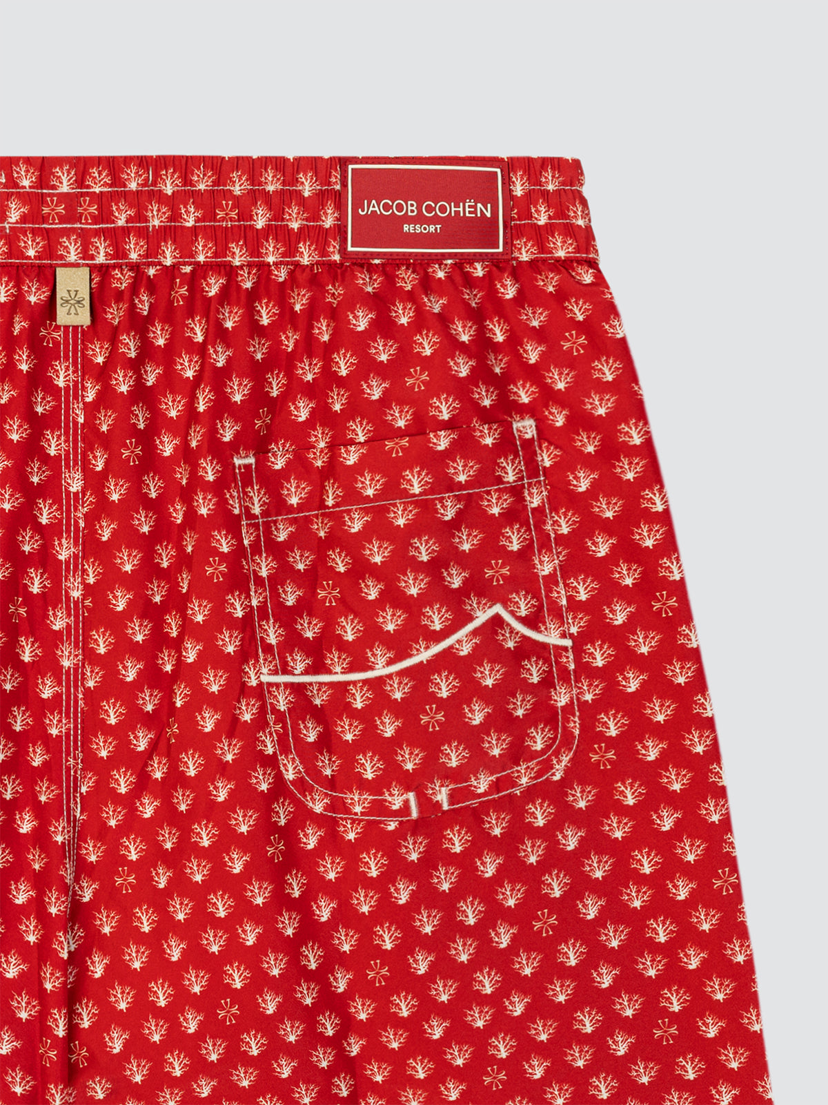 Boxer de bain en tissu technique rouge et blanc à imprimé corail