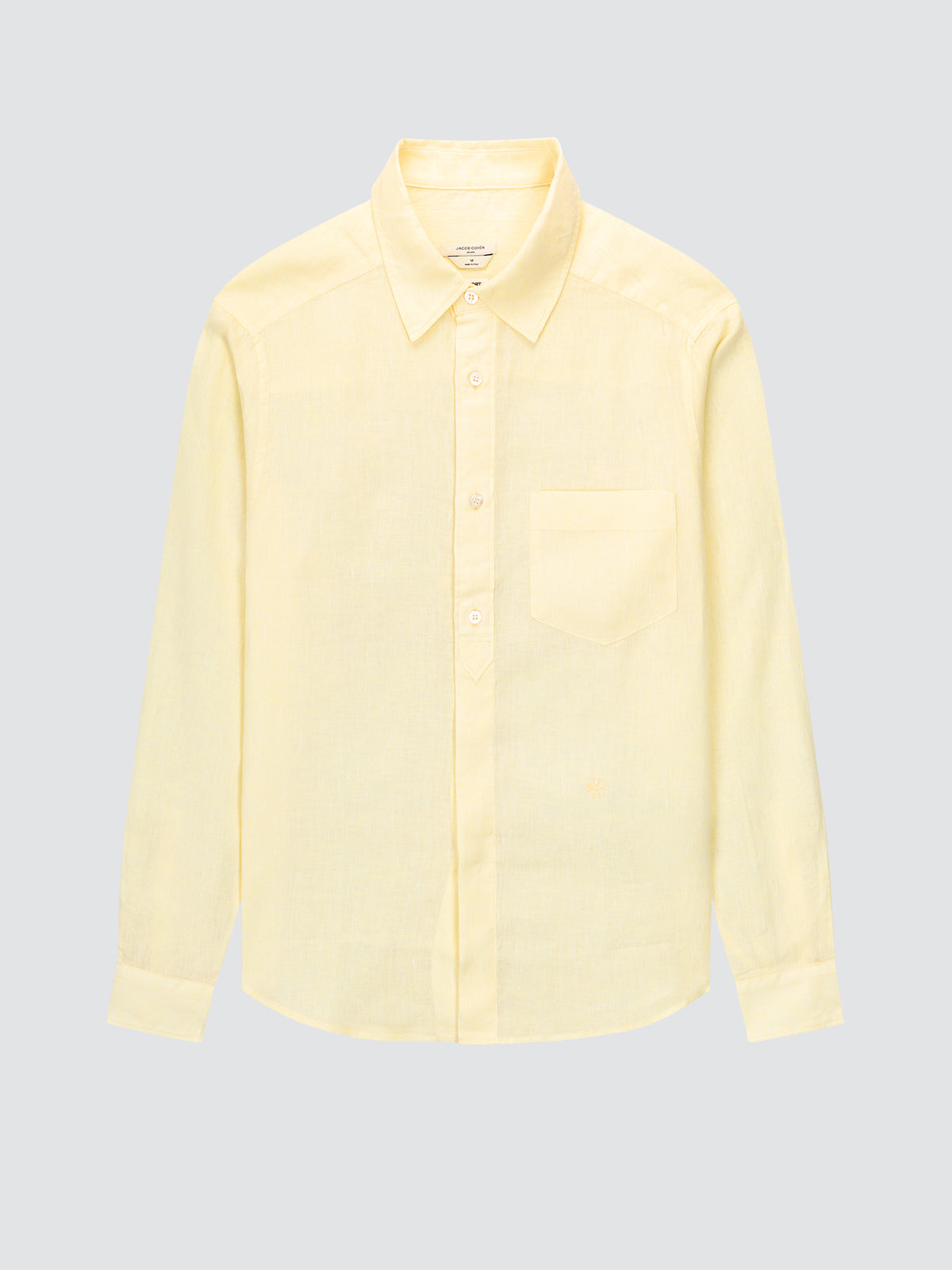 Light yellow shirt on a light gray background