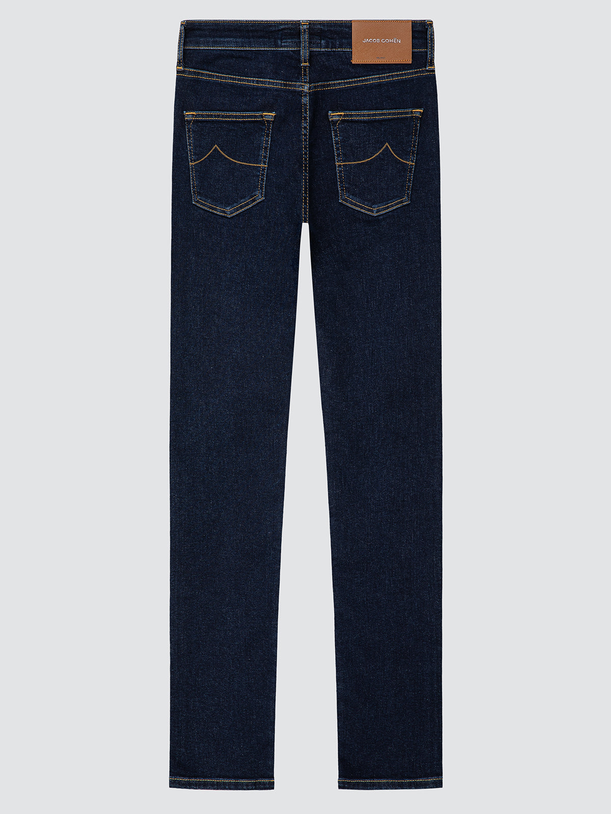 Dark blue jeans with a brand label on a light gray background
