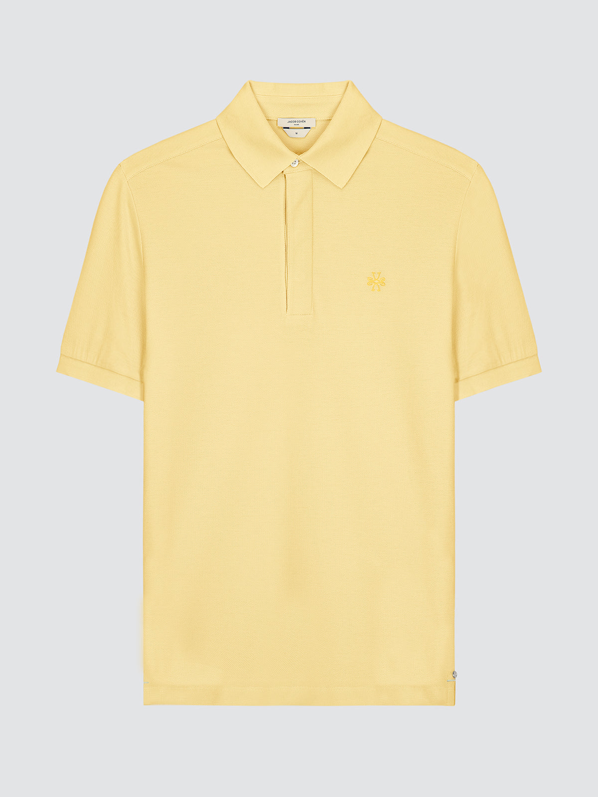 Yellow polo shirt by Jacob Cohen on a light gray background