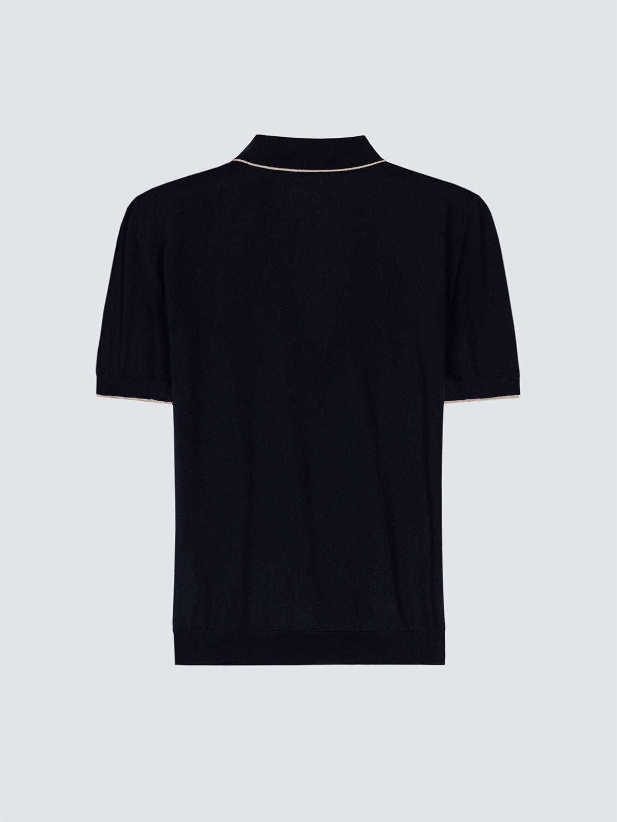 Navy polo shirt on a light gray background