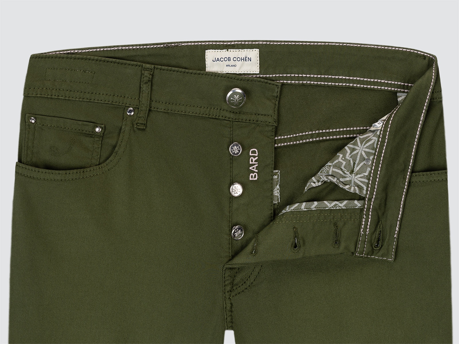 Green pants with visible branding on a light gray background