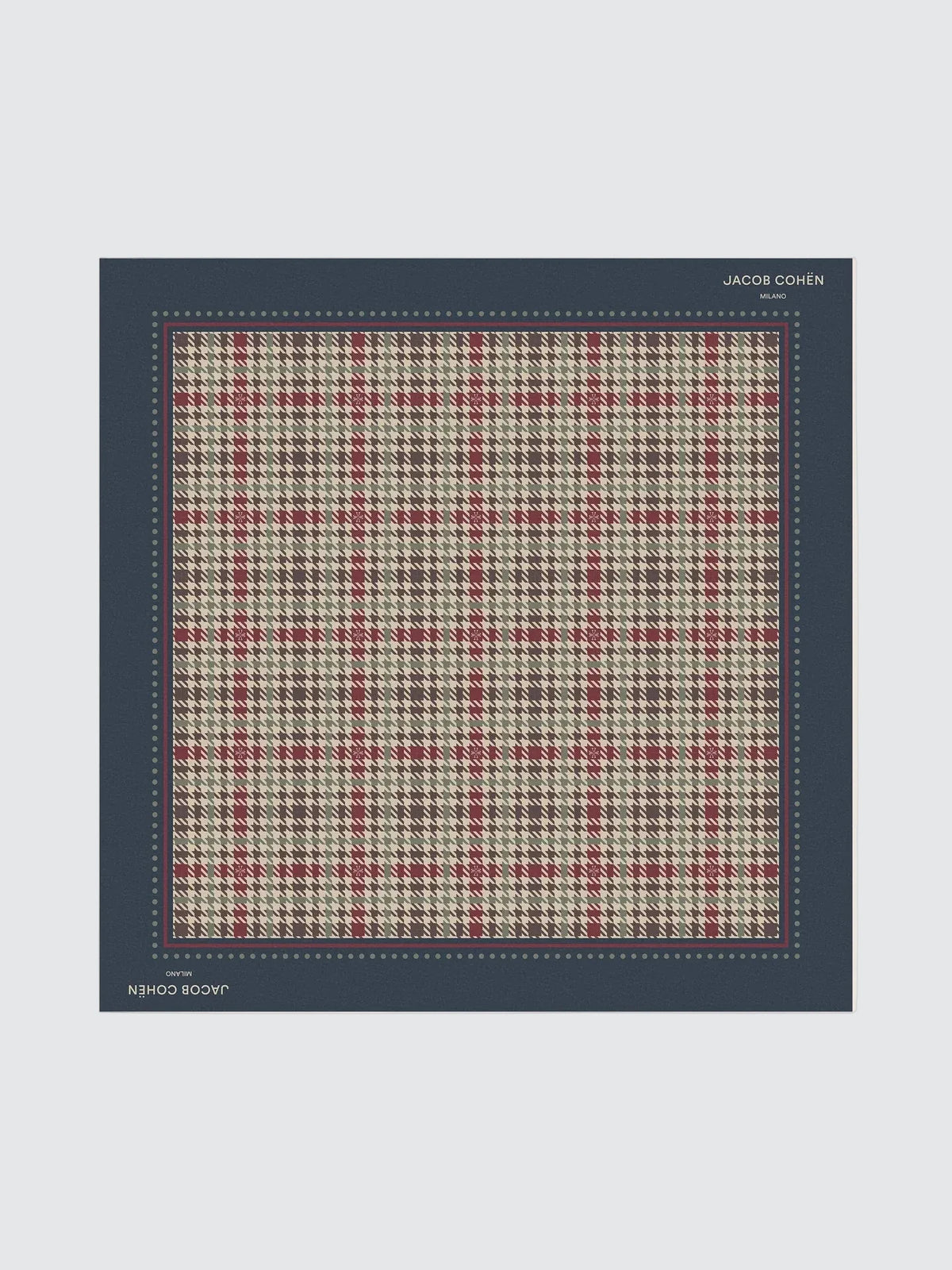 A square scarf or fabric swatch with a houndstooth plaid pattern in beige, red, and gray, bordered by a dark navy blue edge. The brand name 'JACOB COHEN' is printed in white at the top right of the border, and 'JACOB COHEN & CO.