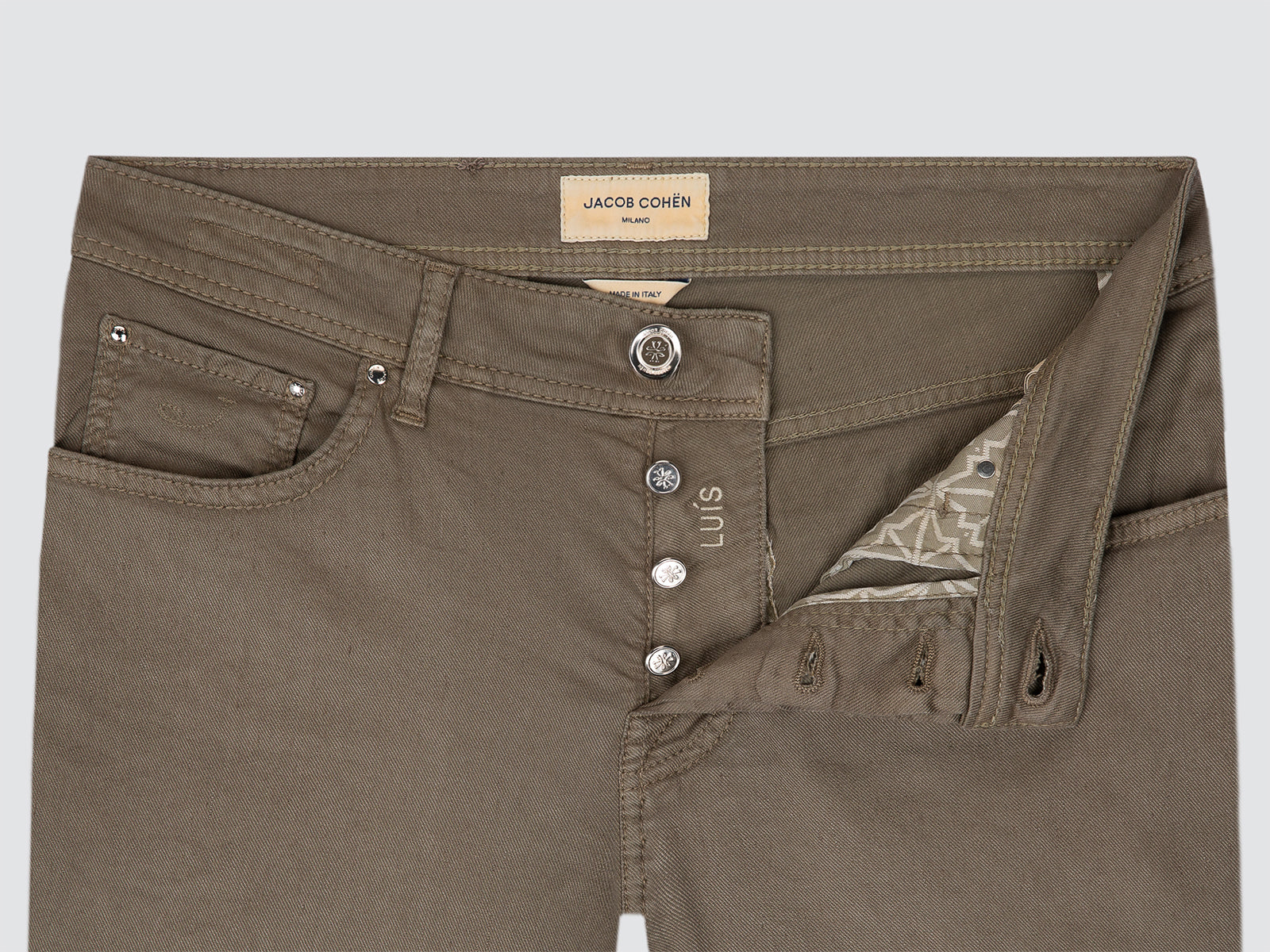 Brown pants with visible brand label on a light gray background