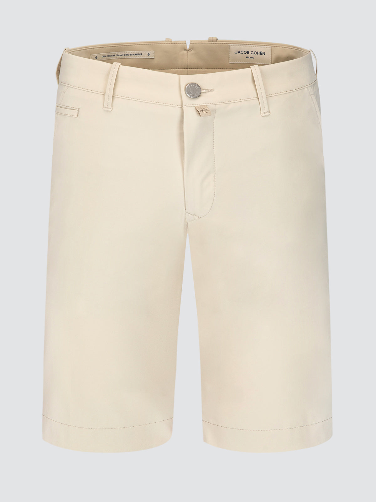 Beige tech shorts on a light gray background