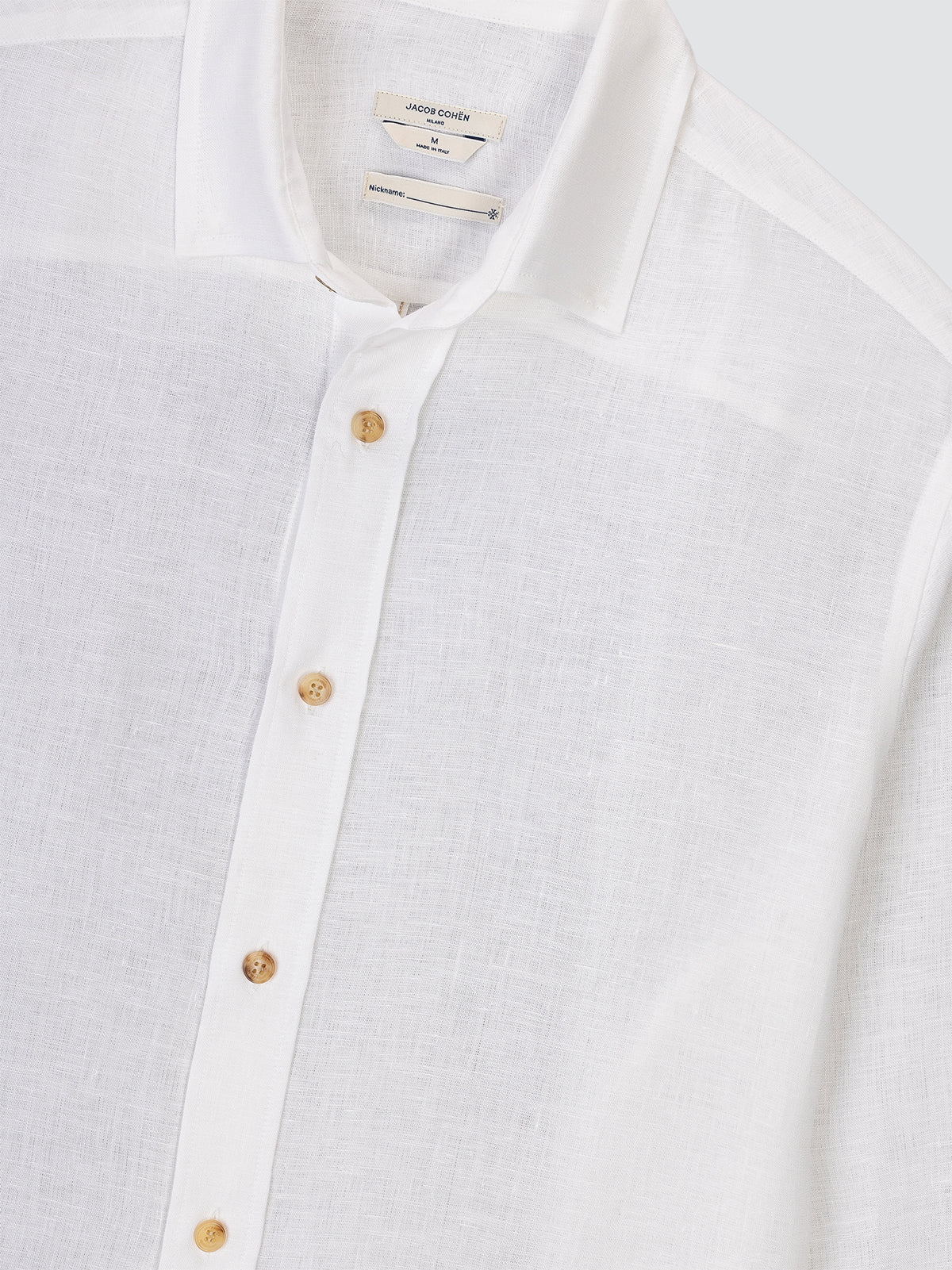 Close-up of a white shirt Jacob Cohen with horn buttons on a light gray background