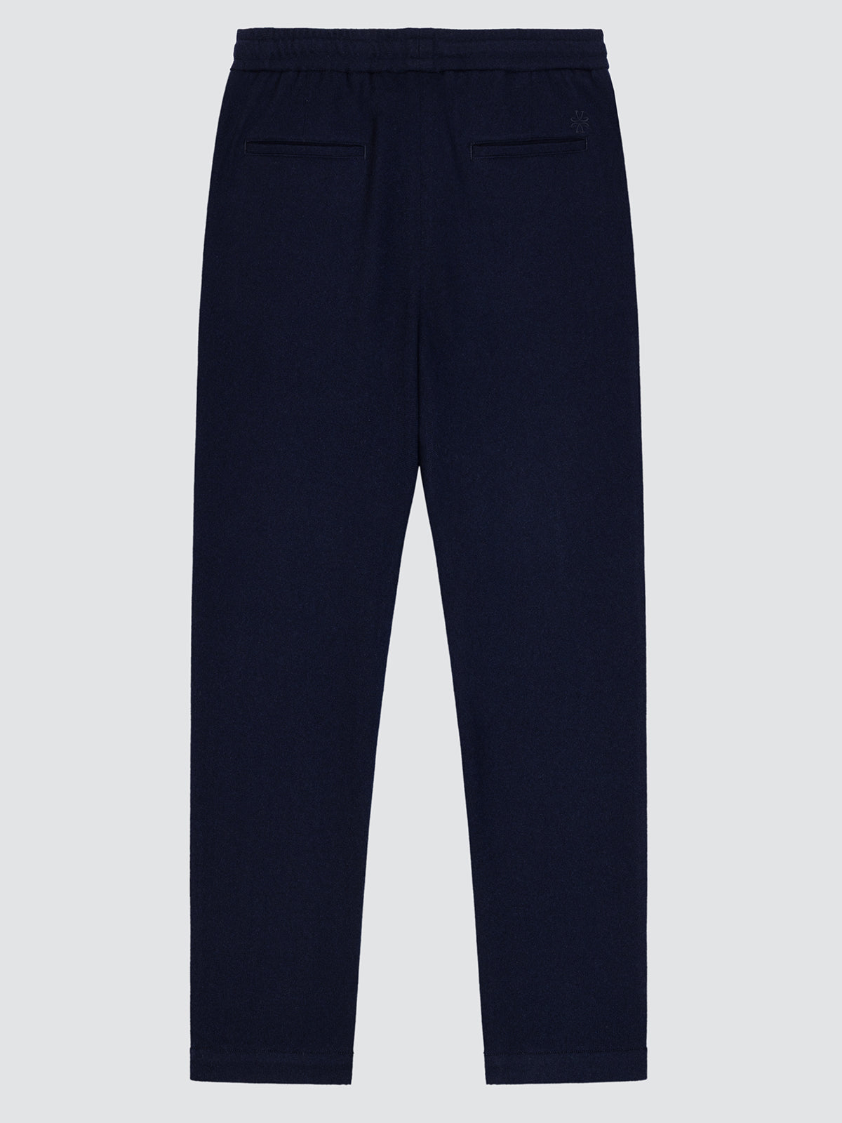 Navy blue pants on a light gray background