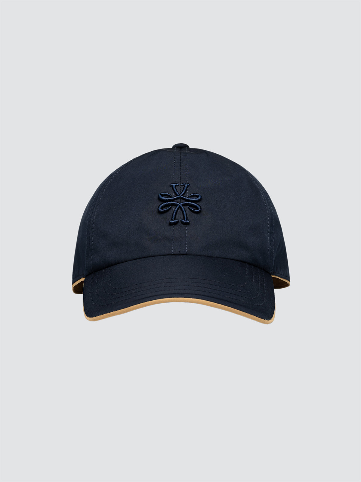 Navy blue cap with a logo on a light gray background