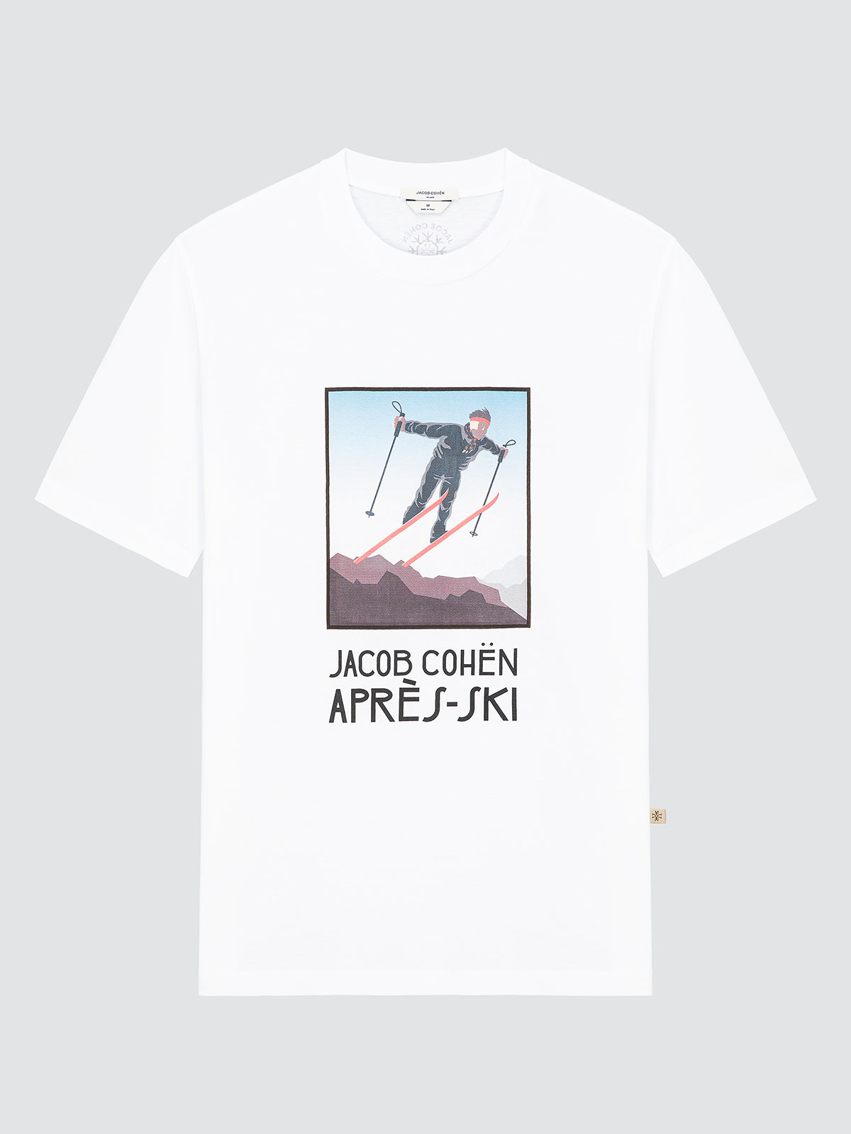 White t-shirt with a graphic of a skier and 'Jacob Cohen Après Ski' text on a gray background