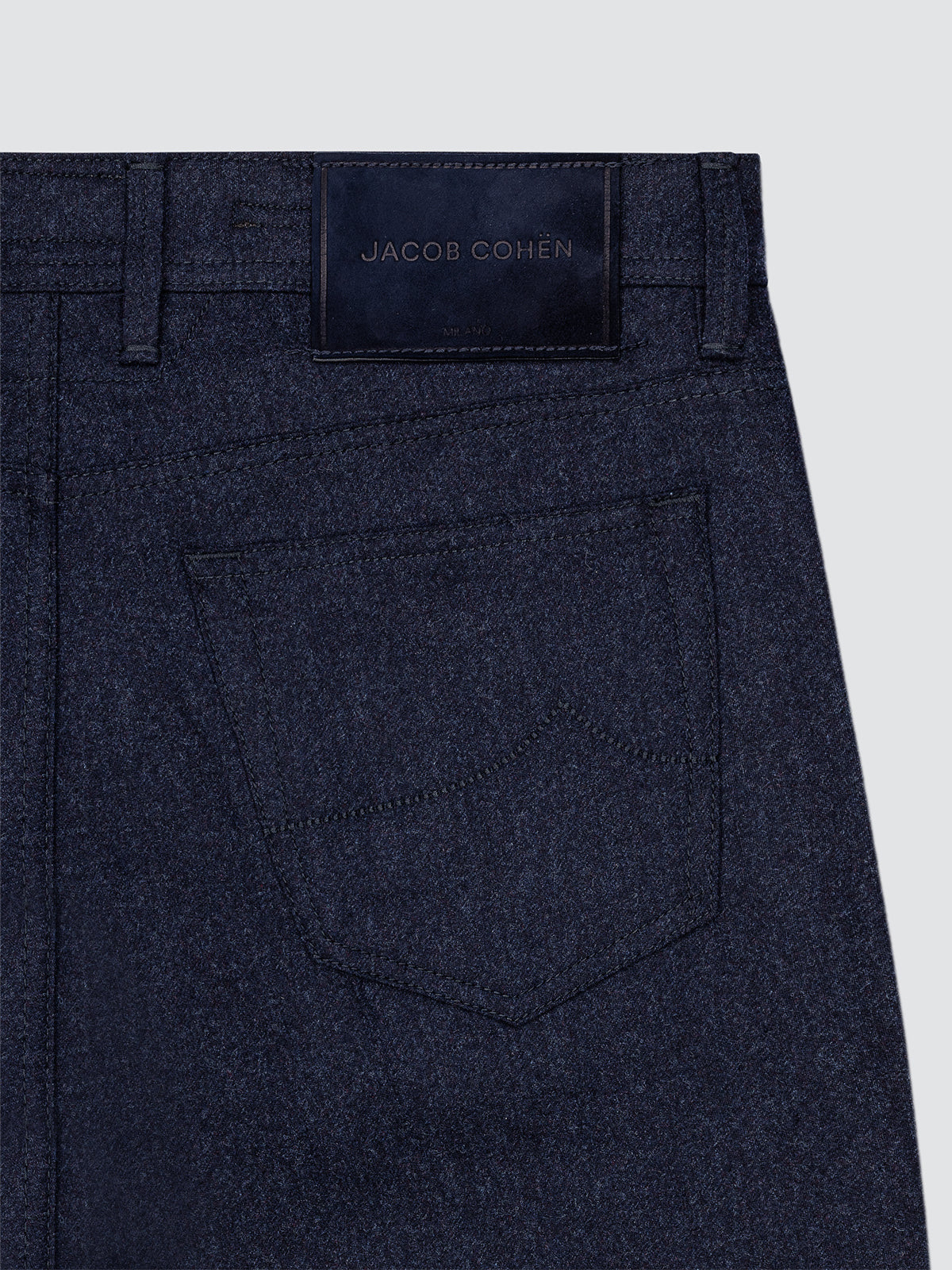 Navy blue pants Jacob Cohën with a visible Jacob Cohen label on a light gray background