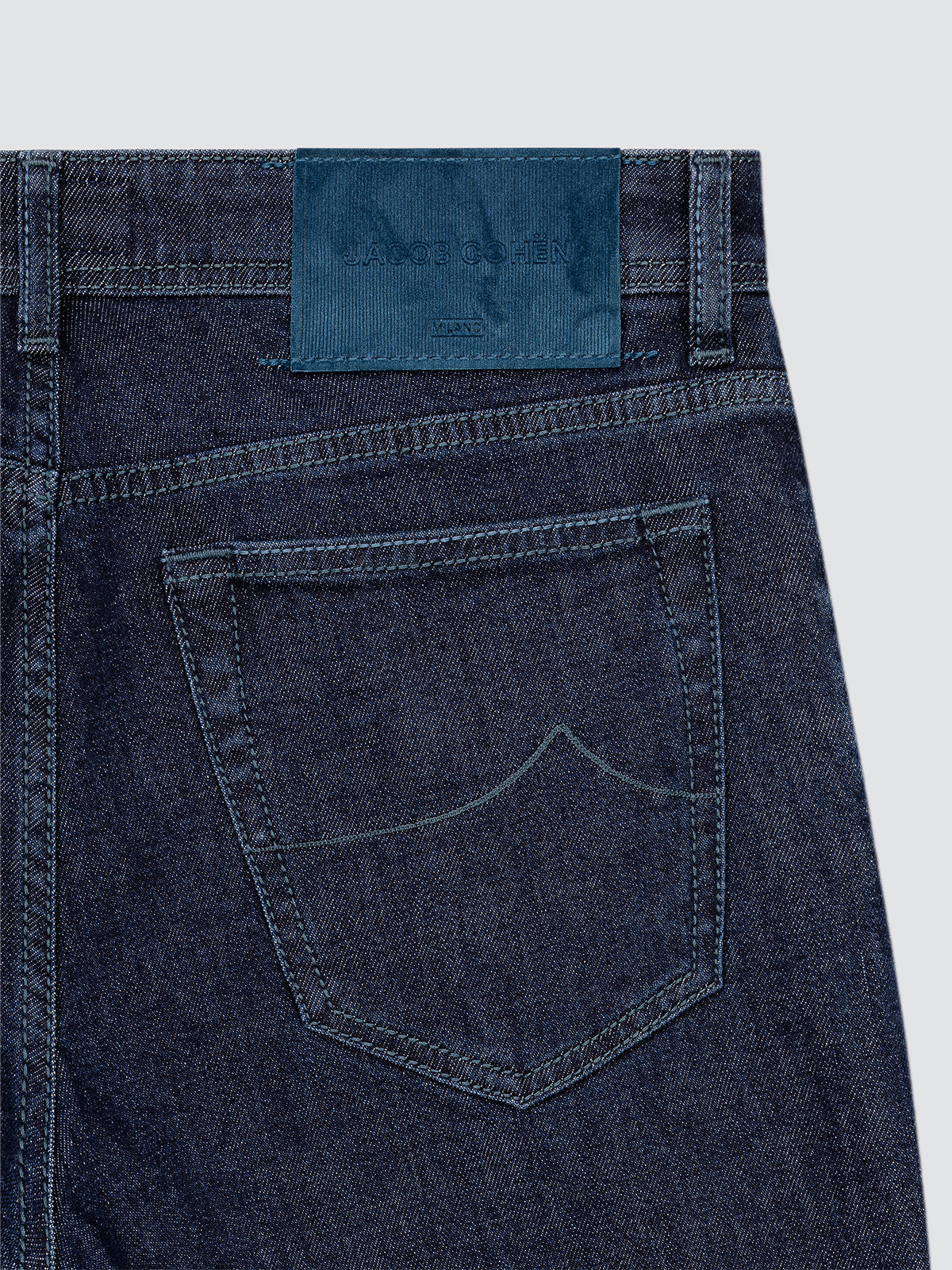 back view of a jeans dark blue indigo Jacob Cohën model bard with a lead grey velvet patch