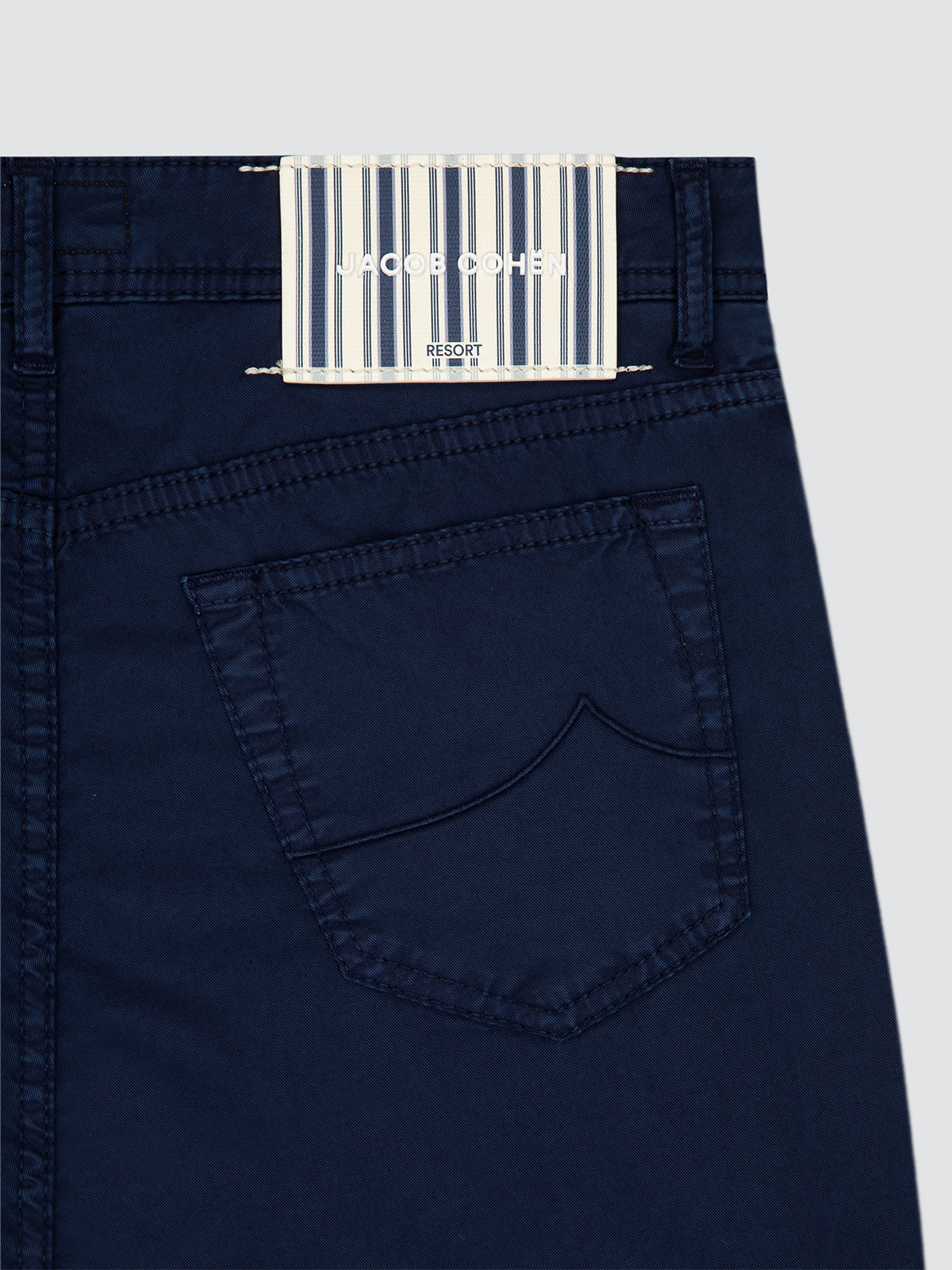 Navy blue pants Jacob Cohen Resort with a brand label on a light gray background