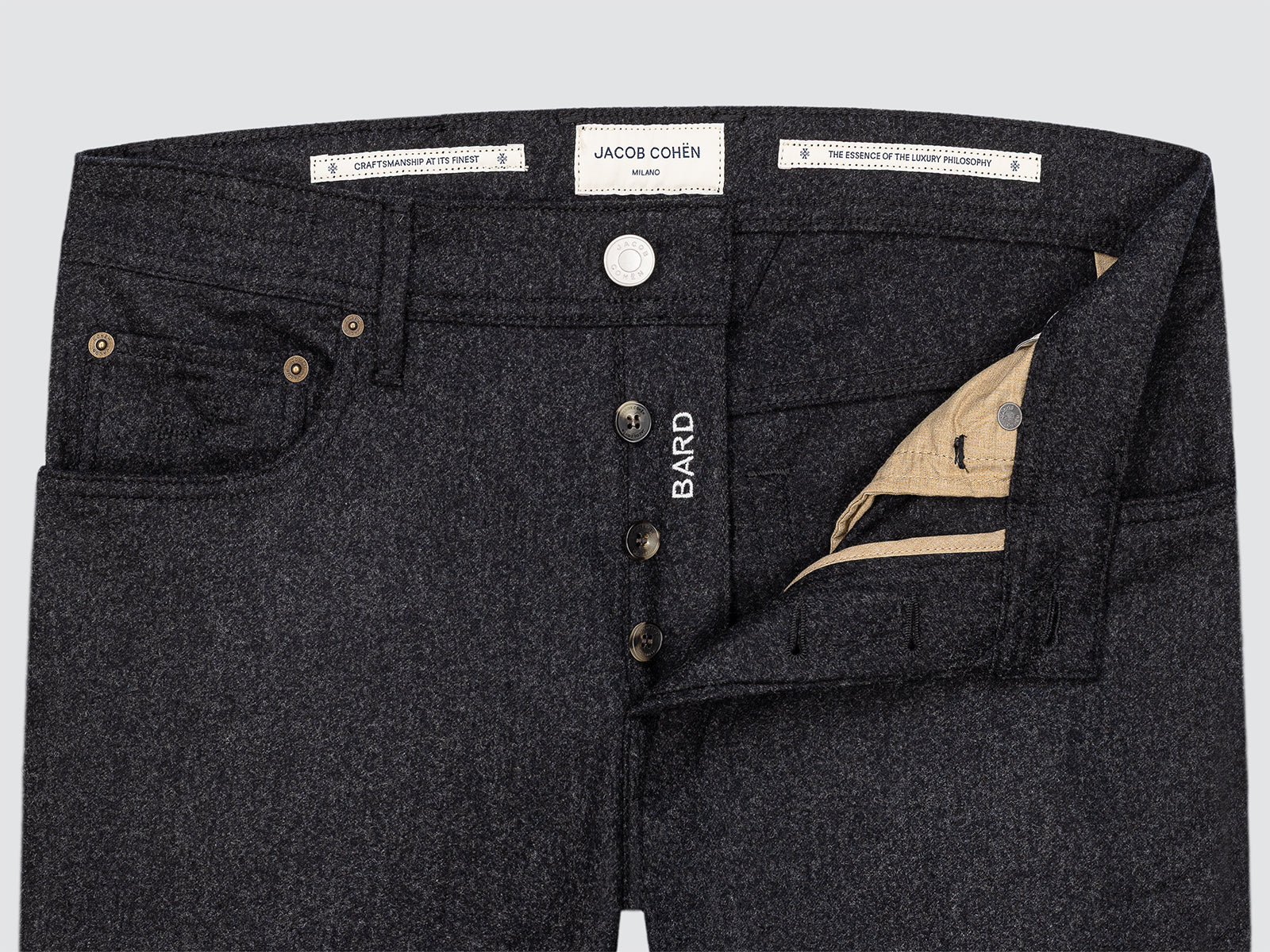 Dark gray wool 5 pockets pants with visible branding on a light gray background