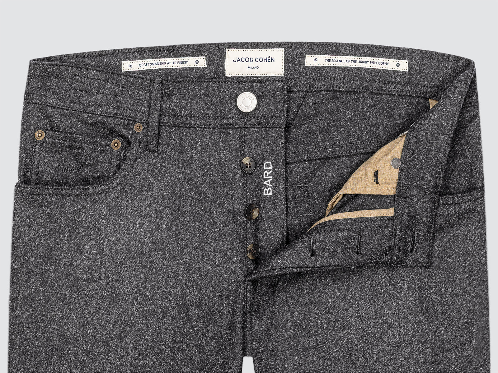 Gray flannel with visible brand labels Jacob cohen on a light gray background