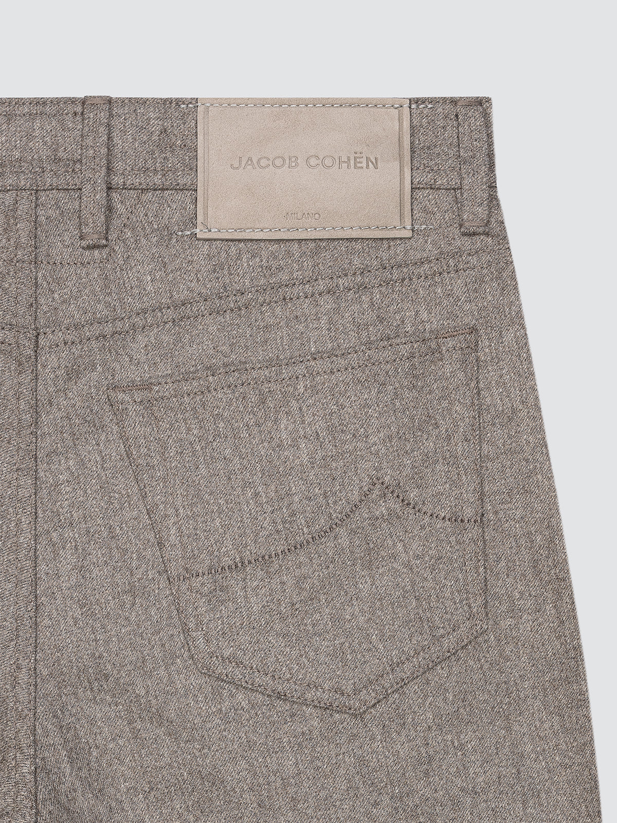 Gray pants with a Jacob Cohen label on a white background