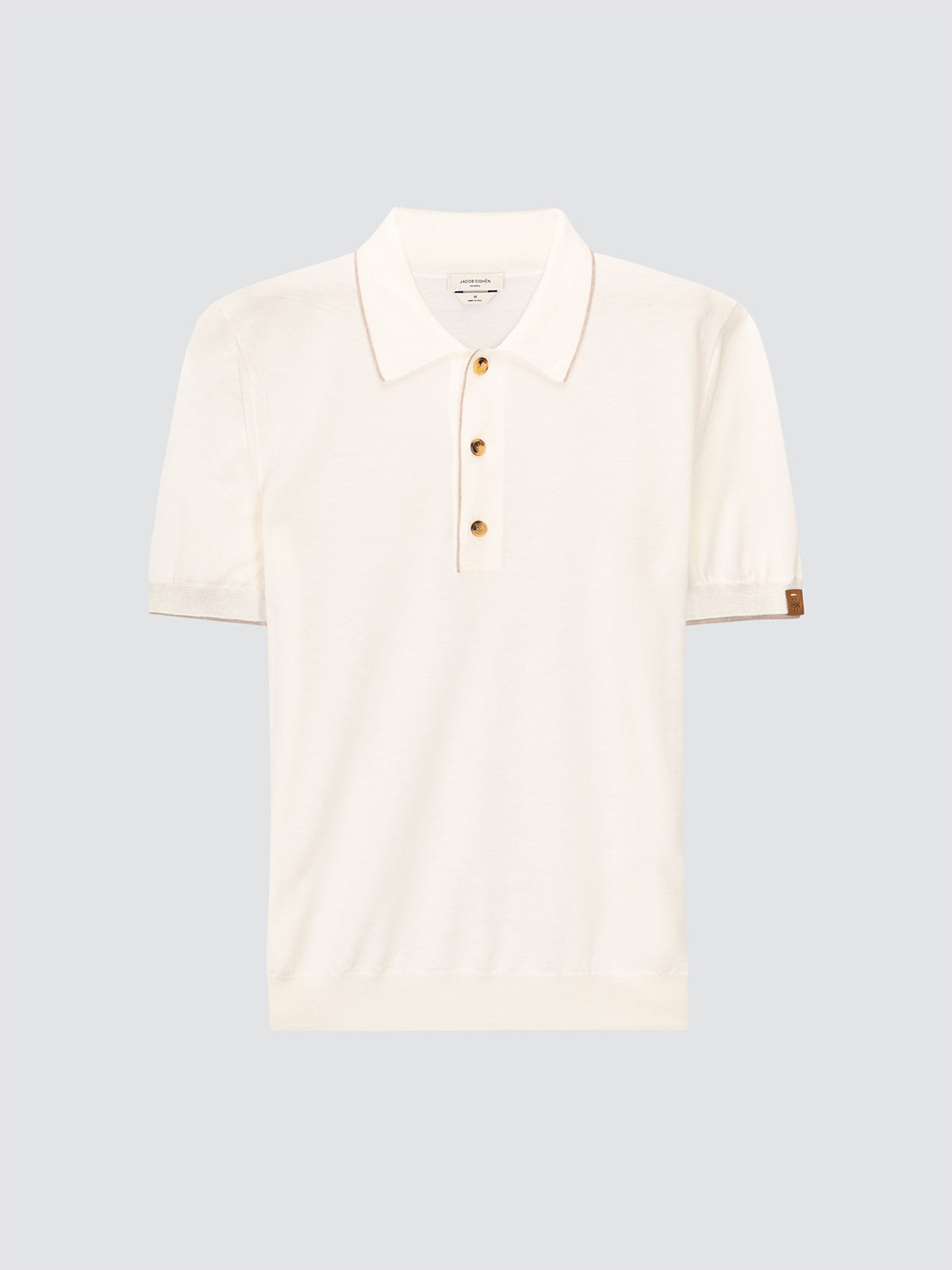 White polo shirt Jacob Cohën with gold buttons on a light gray background