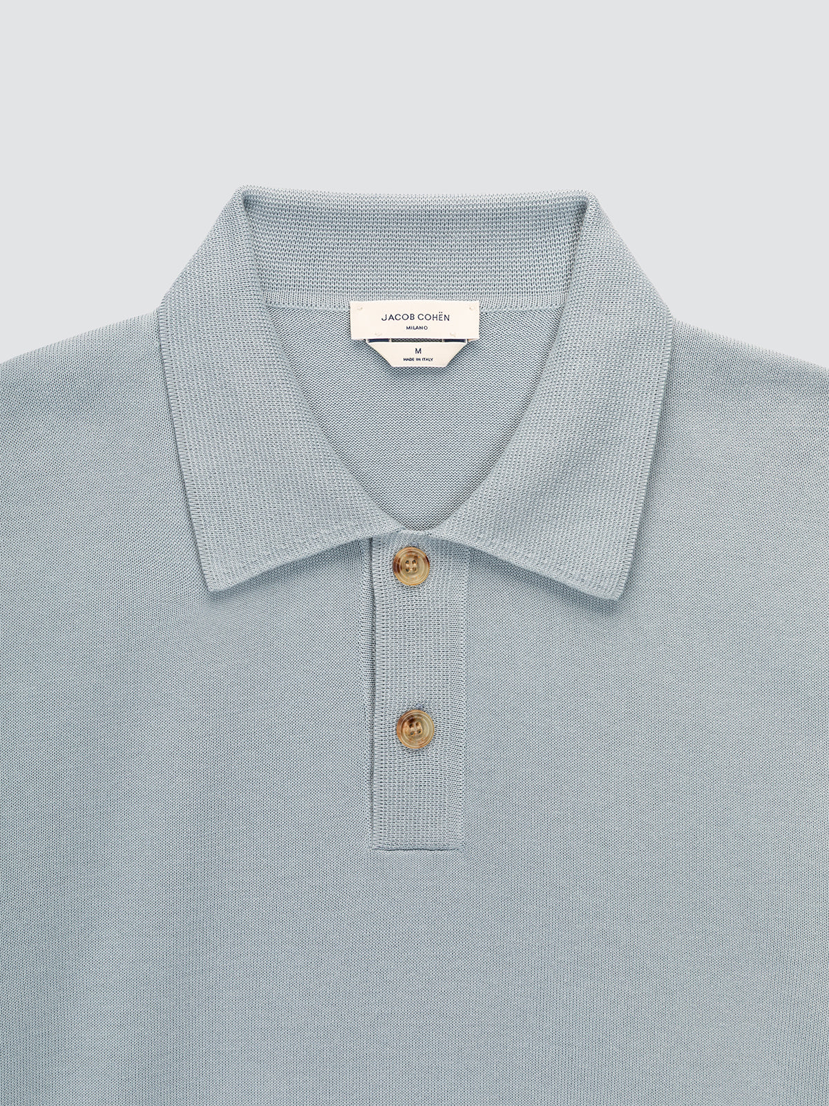 Polo en coton brossé bleu poudré tricoté